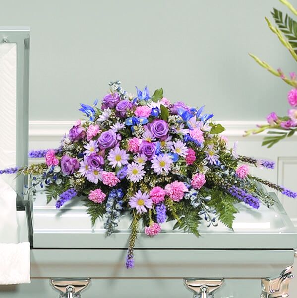 Solace in Pastels Casket Spray Floral Arrangement in Austin, TX